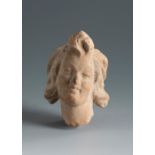 Beautiful satyr's head. Smyrna, 4th-3rd century BC.Terracotta.Provenance: Smyrna, 1895-1905.
