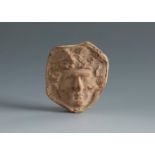 Medusa's head. Smyrna, 4th-3rd century BC.Terracotta.Provenance: Smyrna, 1895-1905. Collection