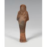 Ushebti. Egypt, Late Antiquity.Terracotta.Size: 10 x 3.5 x 2 cm.Ushebtis are small statuettes that