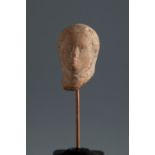 Head of a veiled woman. Smyrna, 4th-3rd century BC.Terracotta.Provenance: Smyrna, 1895-1905.