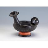 Guttus. Apulia, southern Italy, late 4th century BC.Black-glazed pottery.In good condition. Whole.