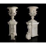 Pair of glasses of pps. s.XIX.Marble.Later base, although the volute is original.Provenance: old