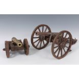 Set of two cannons after 18th century models. Spain, second half of the 20th century.Iron, wood