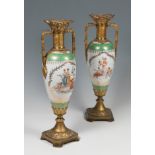 Pair of goblets; Vienna, second half of the 19th century.Gilt bronze and porcelain.Measurements: