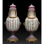 Pair of Sévres vases; second half of the 19th century.Porcelain and gilt bronze bases.Marks on the