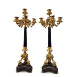 Pair of French Napoleon III candlesticks, ca. 1860-70.Bronze gilt with mercury gilding.Marble base