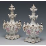 JACOB PETIT (France, 1796-1865).Pair of perfume bottles, 1830-1840.Enamelled porcelain.With marks on