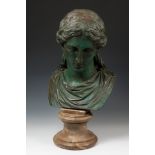 Female bust; Rome, 19th century.Bronze and marble.Measurements: 52 x 25 x 27 cm.Female bust that