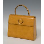 CARTIERHappy Birthday bagPatent leather.Mustard patent leather Happy Birthday bag from Cartier