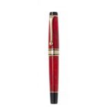 AURORA "75TH ANNIVERSARY" FOUNTAIN PEN.Black and marbled red celluloid barrel and yellow gold