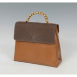 LOEWE.Vintage “Velázquez” bag.Combined leather and golden appliqués.Loewe signature bag, which