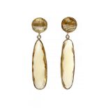 Pair of long earrings with movement in 18 Kts. yellow gold plated silver and yellow topaz. The upper