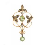 Art Deco pendant brooch, ca. 1930.In yellow gold. Fancy border with synthetic stones. Pin clasp.