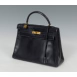 HERMÈSKelly bag, 1960.Made in navy blue Box leather, it has a trapezoidal structure, slightly