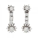 Pair of earrings in 18k white gold. With a line of brilliant-cut diamonds, total weight ca. 0.80