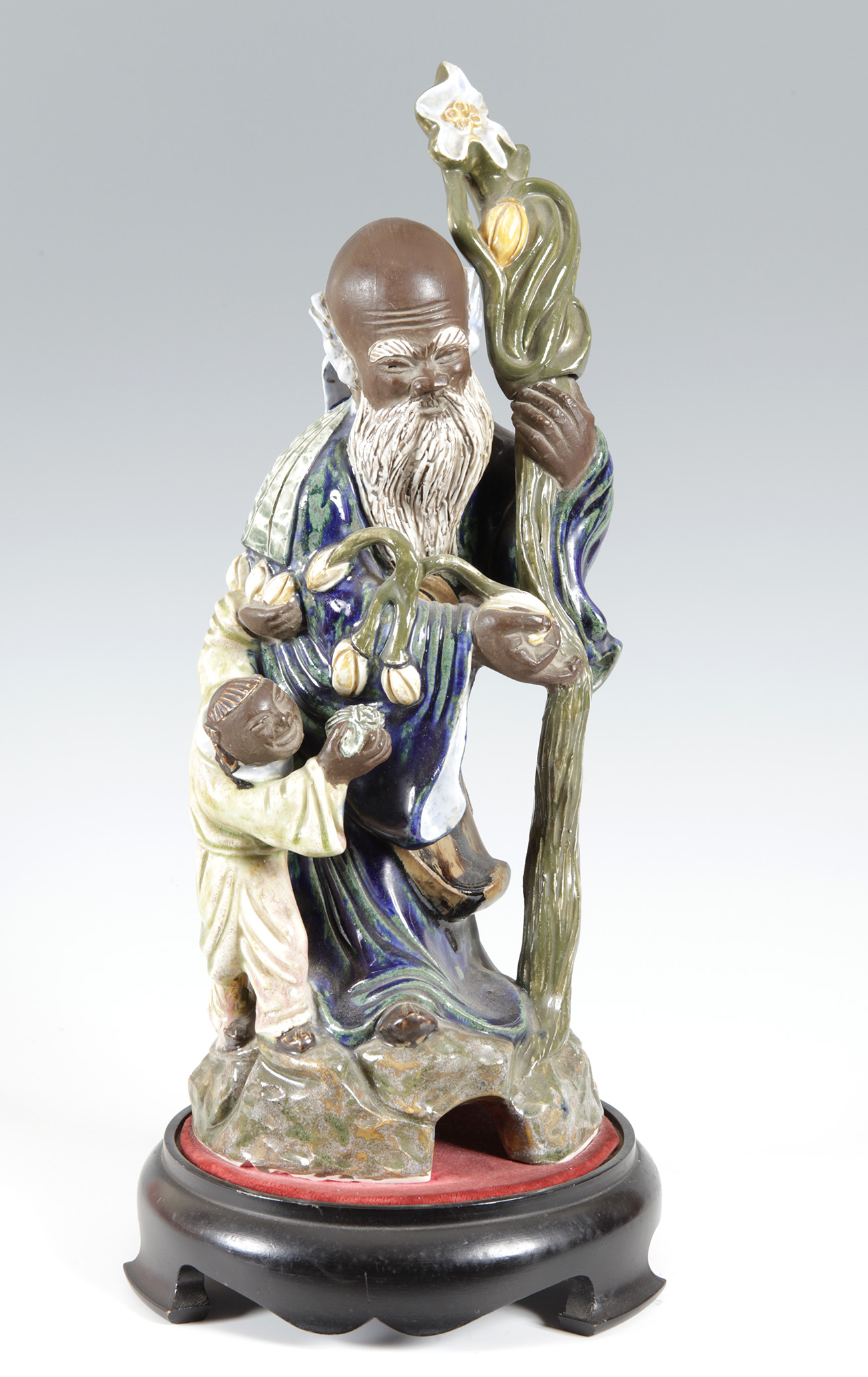 Shou figure; China, early 20th century.Enamelled porcelain.Measurements: 46 x 18 x 15 cm (figure); 6