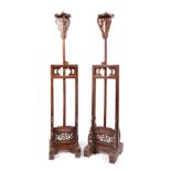 Pair of Chinese torch racks; Guangdong, China, early 20th century.Wood, with height adjustable