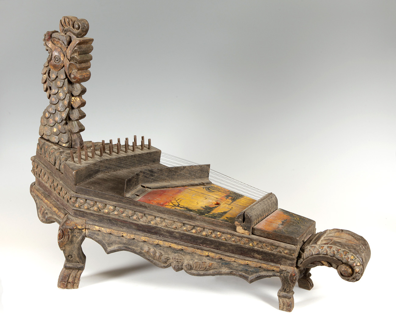 Celempung from Java, Indonesia, first half of the 20th century.Carved wood, later polychromed.