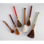 Set of six calligraphy brushes. China mid. 20TH C.Jade, ceramics, hard stones, bamboo, bone and