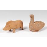 Pair of animal figures; Shenzen, China, Han dynasty (206 BC - AD 220).Terracotta.The bird has a