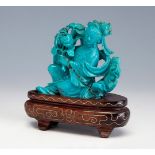 Chinese school of the 20th century."Figure of a fairy".Turquoise carving on wooden base.