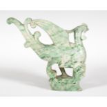 China, early 20th century.Green jade carving. Measurements: 15 x 16 cm.Ornamental piece in round
