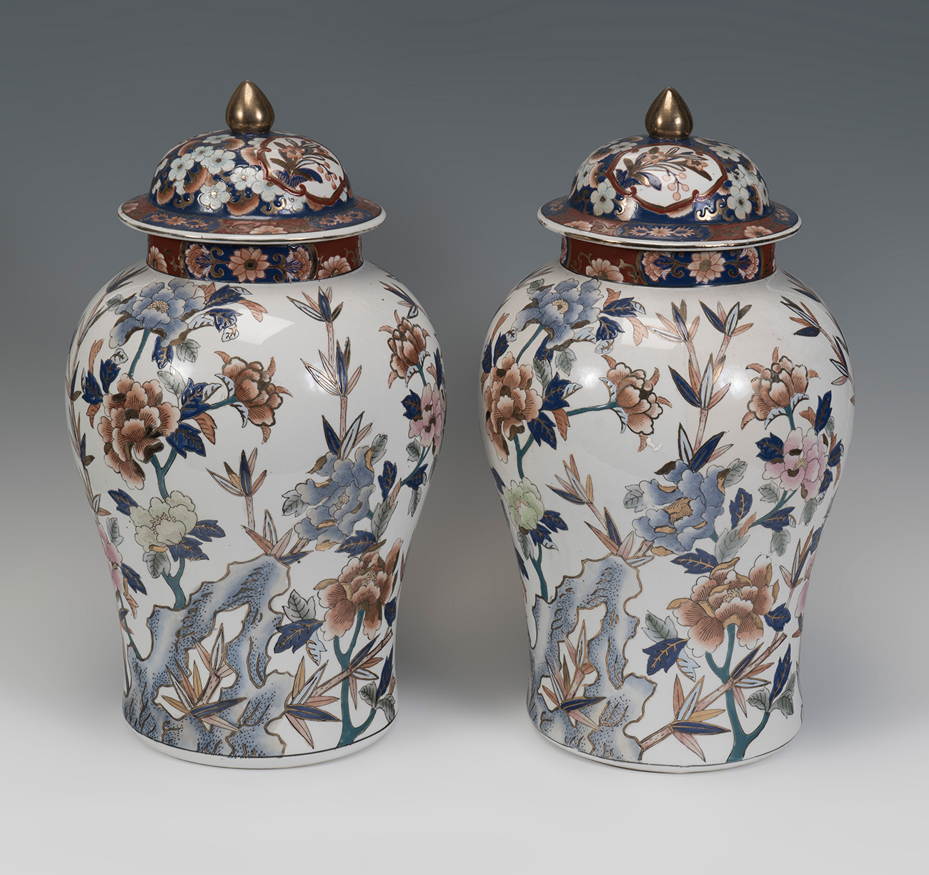 Pair of Imari style tibors; China, late 19th - early 20th century.Hand-painted porcelain.Signed on