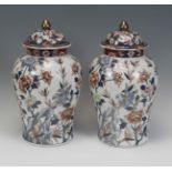 Pair of Imari style tibors; China, late 19th - early 20th century.Hand-painted porcelain.Signed on