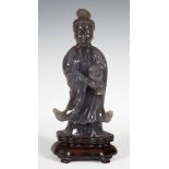 Image of Guanyin. China, early 20th century.Chalcedony.Measurements: 25 x 13 x 8 cm (without base) ;