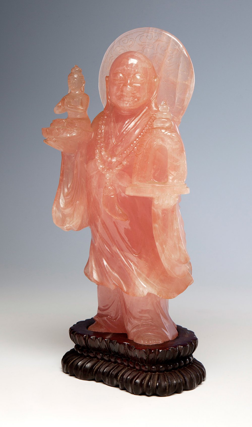 Chinese school of the 20th century.Buddhist monk with Buddha and temple.Rose quartz on wooden base.