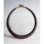 Kalabubu tribal necklace. Sumatra, Indonesia, late 19th century.Coconut shell and brass.Use marks.