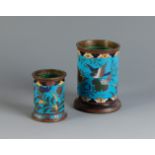 Two brush pots. Japan, Edo period, 19th century.Bronze and cloisonné enamels.With marks of use.