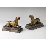 Italian work; circa 1500."Pair of lions.Gilded bronze.Presents iron reeds.Measurements. 10 x 14 x