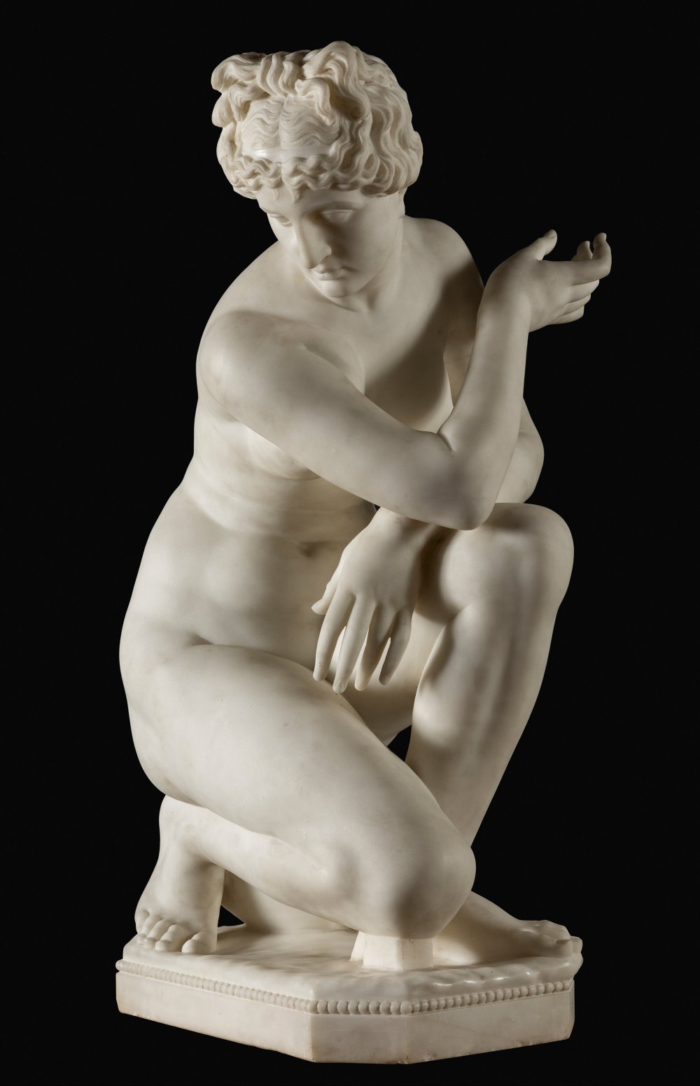FRATELLI ROMANELLI. Italy, 19th century."Crouching Aphrodite", Florence.White marble.Signed and