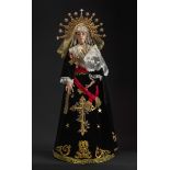 Virgin of candlestick. Spain, 20th century.Wooden candlestick structure. Head and hands in