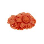 Japanese corallium flower-shaped brooch.Japanese coral brooch in the shape of a flower carved in a