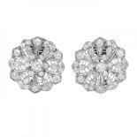 Pair of earrings in 18k white gold. and diamonds. Rosette model with elaborate openwork work, dotted