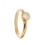 Solitaire ring made in 18 kt yellow gold, with a central brilliant cut diamond set in a bezel,