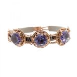 19th century bracelet. In 14k rose gold. with circular pieces that set synthetic corundums with an