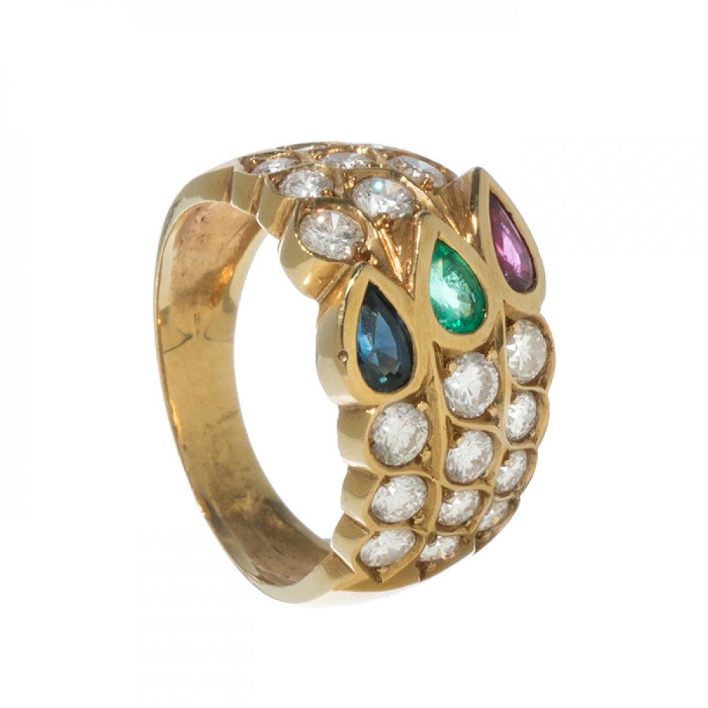 Ring in 19.2kt yellow gold with diamonds, sapphire, emerald and ruby. Model with three band