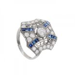 Ring in platinum, diamonds and sapphires. Model with geometric front, with central diamond,