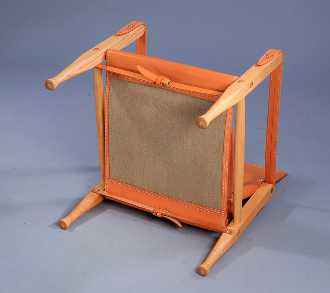 KAARE KLINT (Frederiksberg, 1888-Copenhagen, 1954) for RUD RASMUSSEN.Safaristol chair with stool, - Image 7 of 7