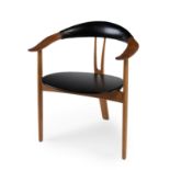 ARNE HOVMAND-OLSEN for Mogens Kold.Armchair. Model 308, ca.1950s.Teak wood and black leather.