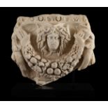 Fragment of a sarcophagus with an image of a medusa. Rome, 1st-3rd century AD.Carved marble.