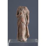 Headless female figure holding a chiton. Smyrna, 3rd century BC.Terracotta.Provenance: Smyrna,