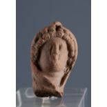 Female head. Smyrna, 3rd century BC.Terracotta.Provenance: Smyrna, 1895-1905. Collection Paul Gaudin