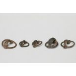 Set of five ring-shaped fibulae; Celtiberian culture, Hispania, 3rd-2nd century BC.Bronze.Three of
