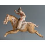 Female polo player. China, Tang dynasty, AD 618-906.Terracotta and pigments.Attached