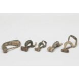 Set of five turned-foot fibulae; Celtiberian culture, Hispania, 3rd-2nd century BC.Bronze.All of