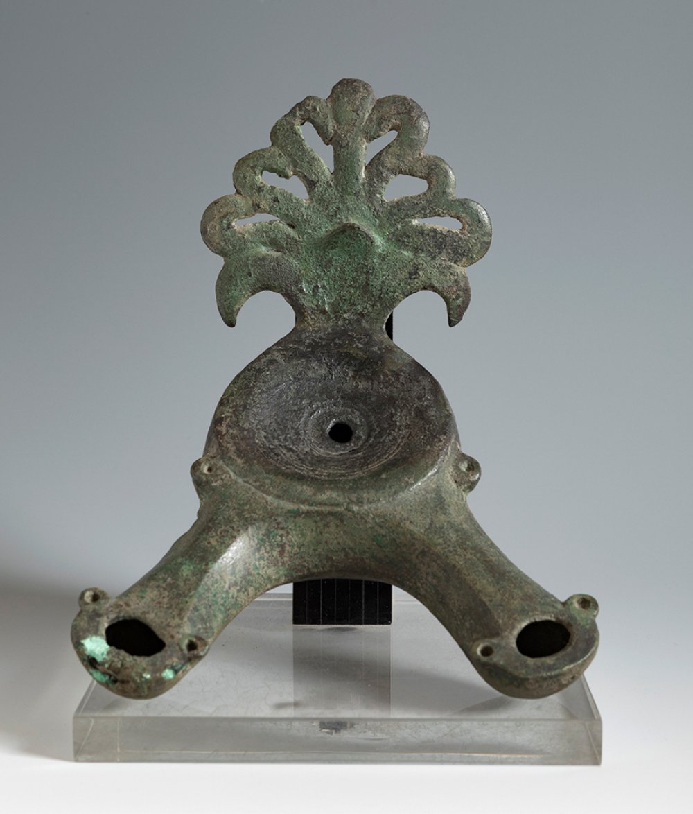 Lucerne with a double spout. Roman, 3rd c. AD.Bronze.Provenance: private collection, Saint-Cloud,